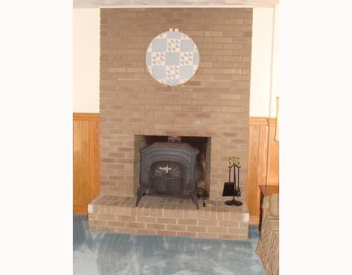 111 Redcut Lodge Road Latrobe, PA 15650 - Photo 14 of 18 Den/Family/Great Room. Family room brick fireplace with a wood burner and a full brick chimney on the outside.