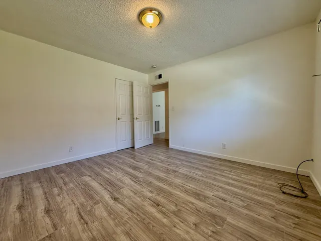 a view of an empty room and a window