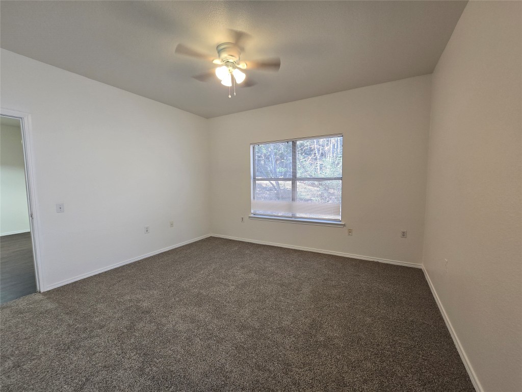 5404 Garden View Cove Austin, TX 78724 - Photo 13 of 28 an empty room with a window