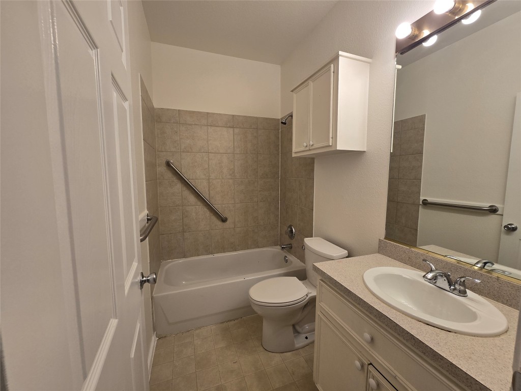 5404 Garden View Cove Austin, TX 78724 - Photo 16 of 28 a bathroom with a sink toilet and shower