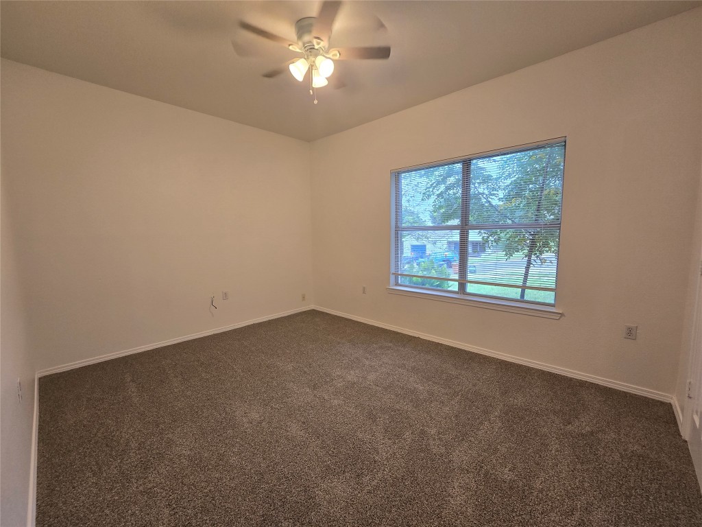 5404 Garden View Cove Austin, TX 78724 - Photo 21 of 28 an empty room with a window