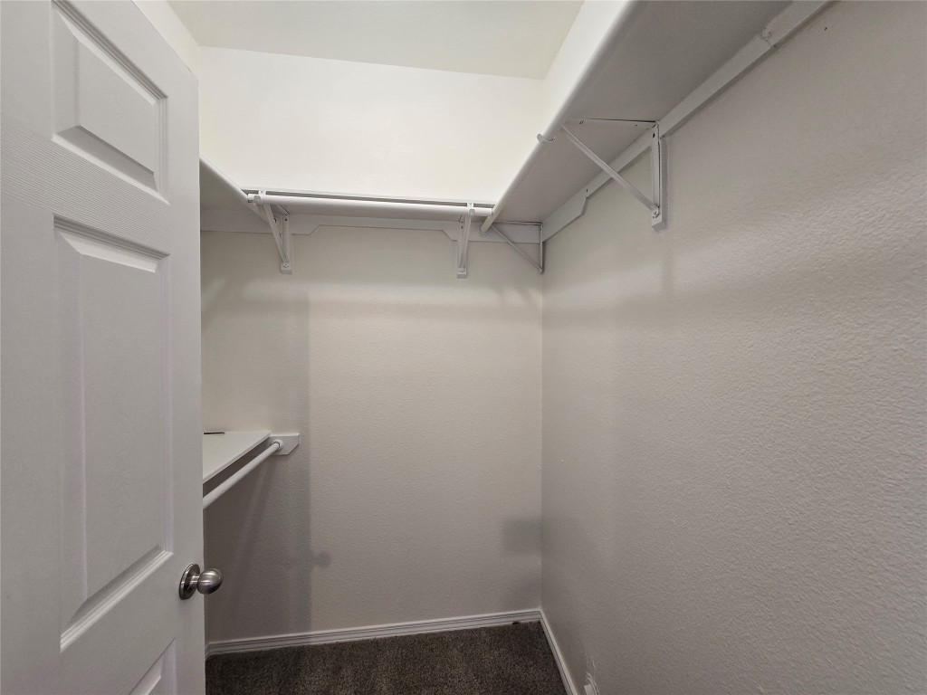 5404 Garden View Cove Austin, TX 78724 - Photo 25 of 28 a view of walk in closet