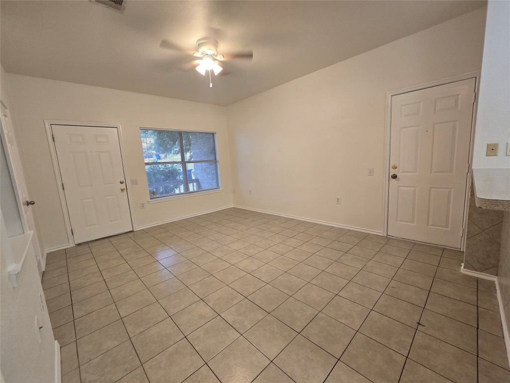 5404 Garden View Cove Austin, TX 78724 - Photo 3 of 28 a view of an empty room and chandelier fan