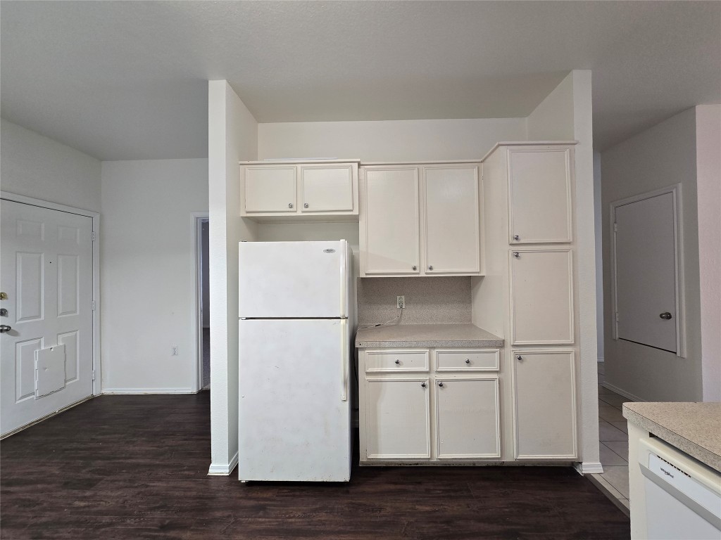 5404 Garden View Cove Austin, TX 78724 - Photo 9 of 28 a white refrigerator freezer sitting in a kitchen
