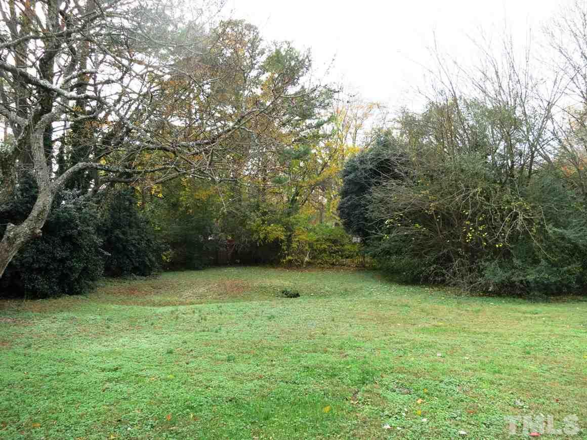 5305 Country Court Raleigh, NC 27609 - Photo 18 of 21 The spacious fenced backyard is surrounded by trees and there is a Storage Rm off oversized carport.