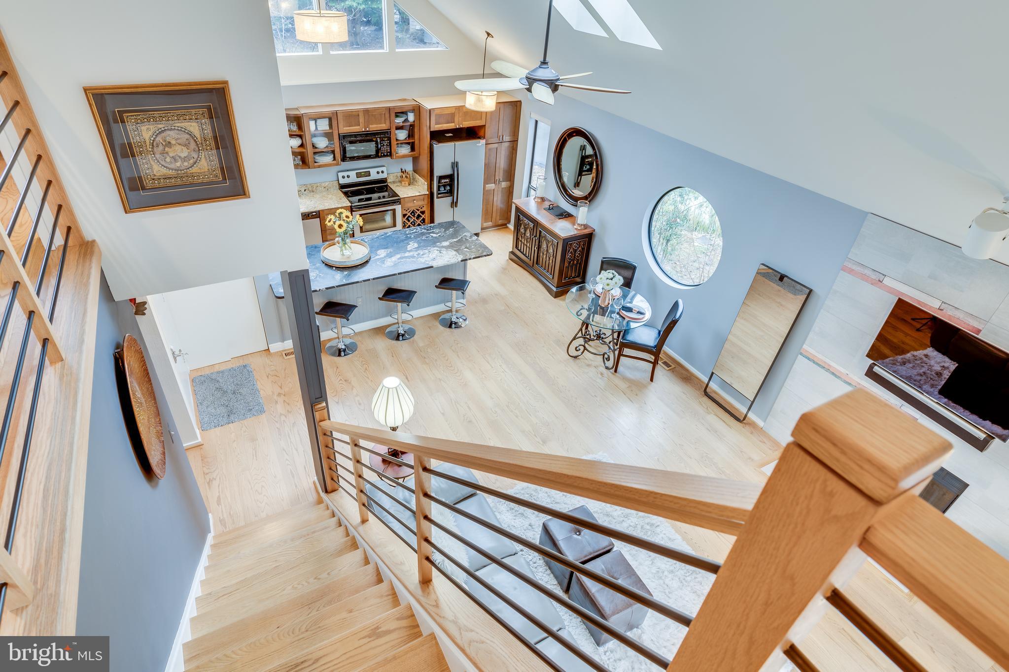 11900 Moss Point Lane Reston, VA 20194 - Photo 13 of 33 a living room with furniture and a clock