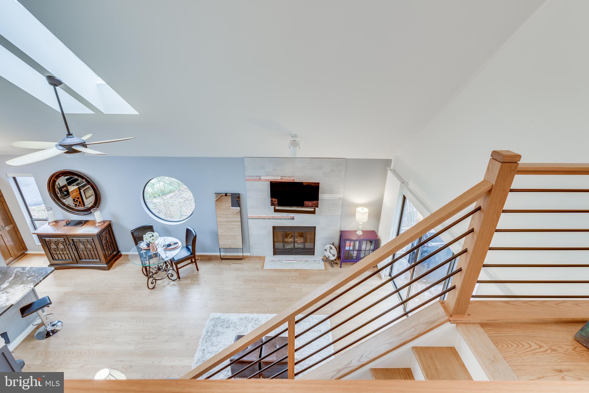 11900 Moss Point Lane Reston, VA 20194 - Photo 14 of 33 a living room with furniture and a flat screen tv