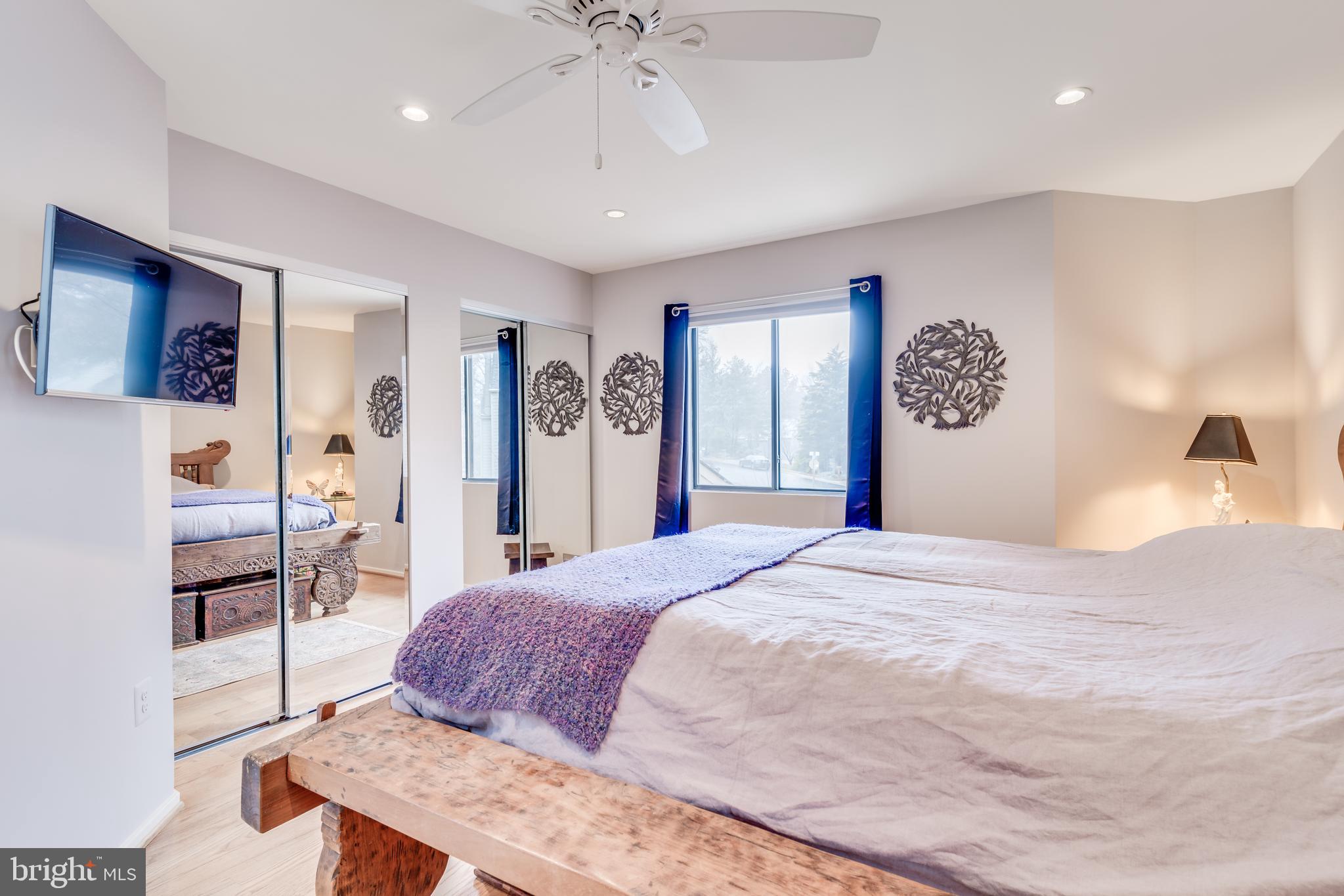 11900 Moss Point Lane Reston, VA 20194 - Photo 16 of 33 a spacious bedroom with a bed and a dresser
