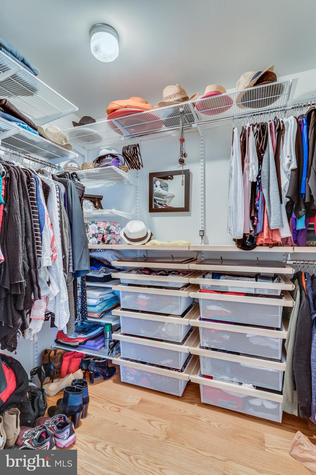 11900 Moss Point Lane Reston, VA 20194 - Photo 18 of 33 a view of walk in closet with clothes and shoes
