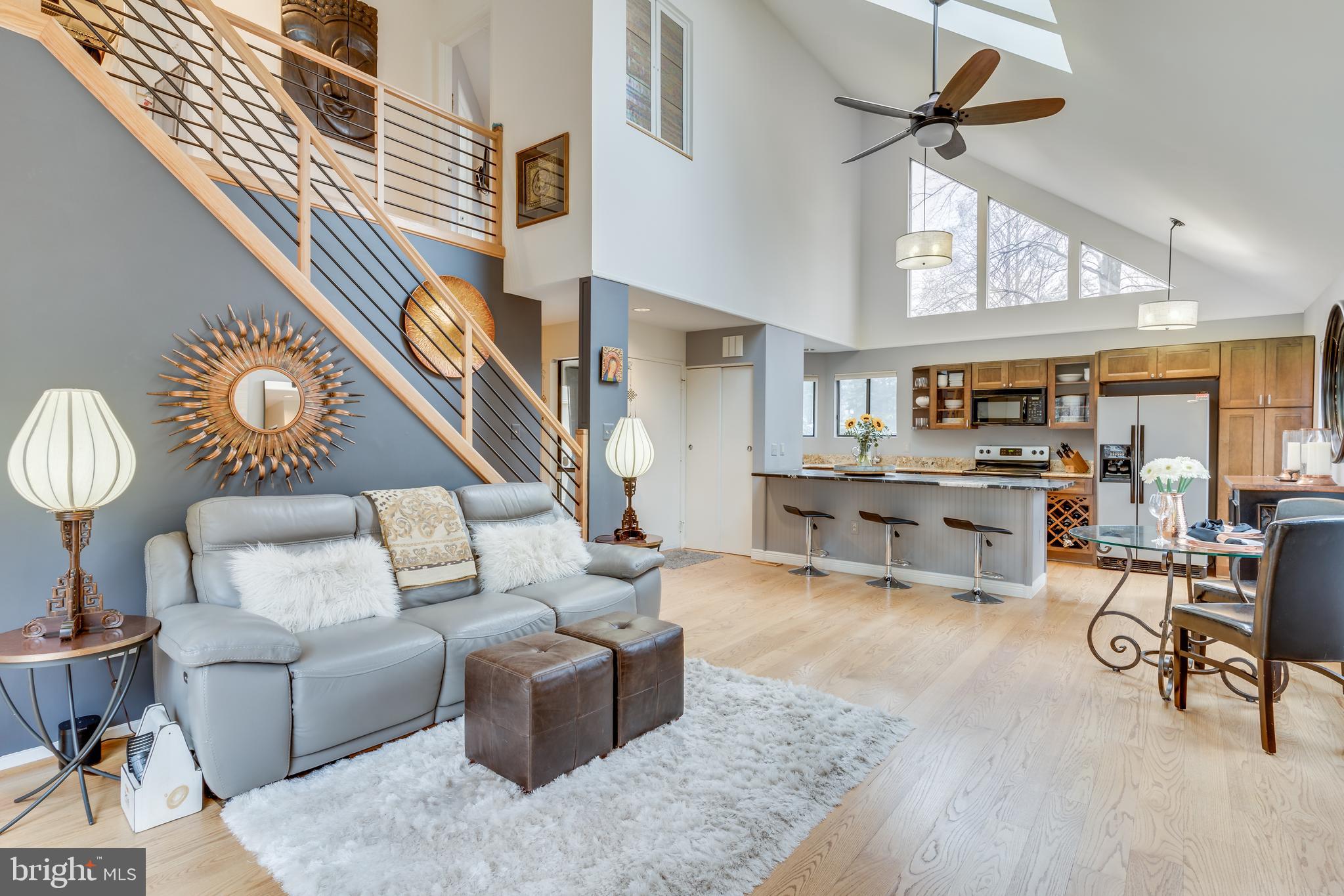 11900 Moss Point Lane Reston, VA 20194 - Photo 3 of 33 a living room with furniture and a ceiling fan
