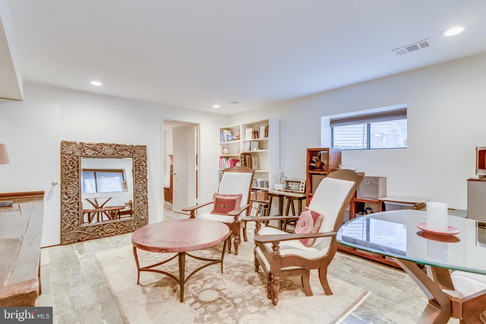 11900 Moss Point Lane Reston, VA 20194 - Photo 20 of 33 a living room with furniture a rug and a window
