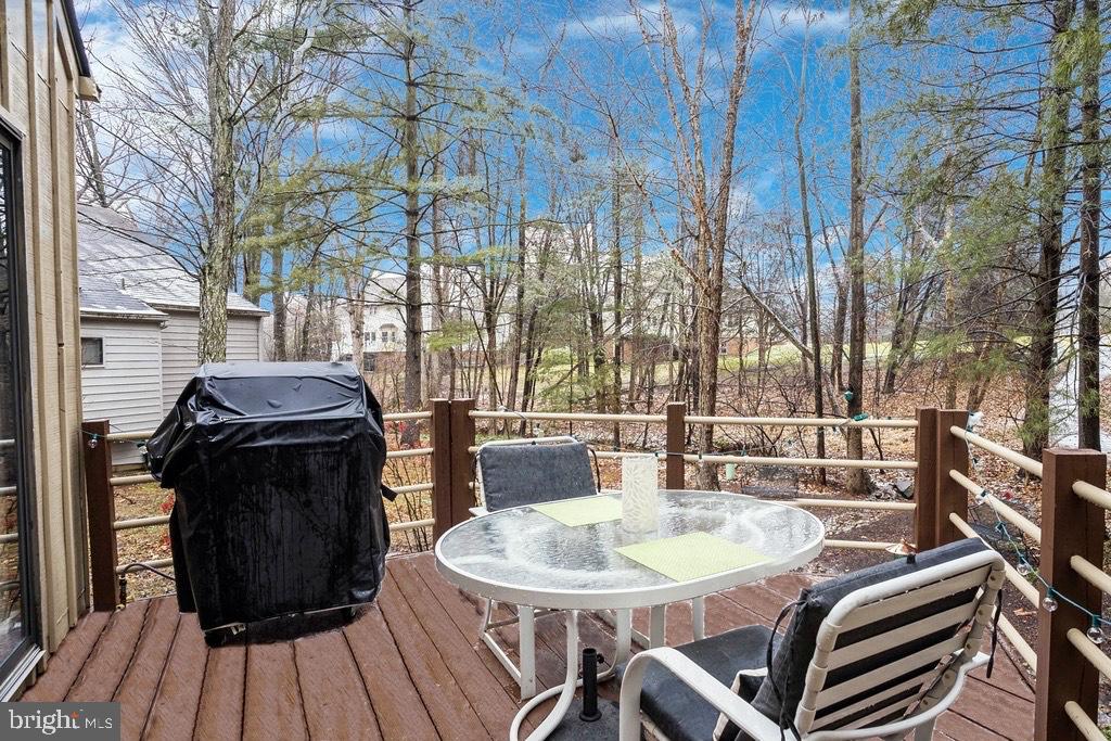 11900 Moss Point Lane Reston, VA 20194 - Photo 27 of 33 a table and chairs in front of a building
