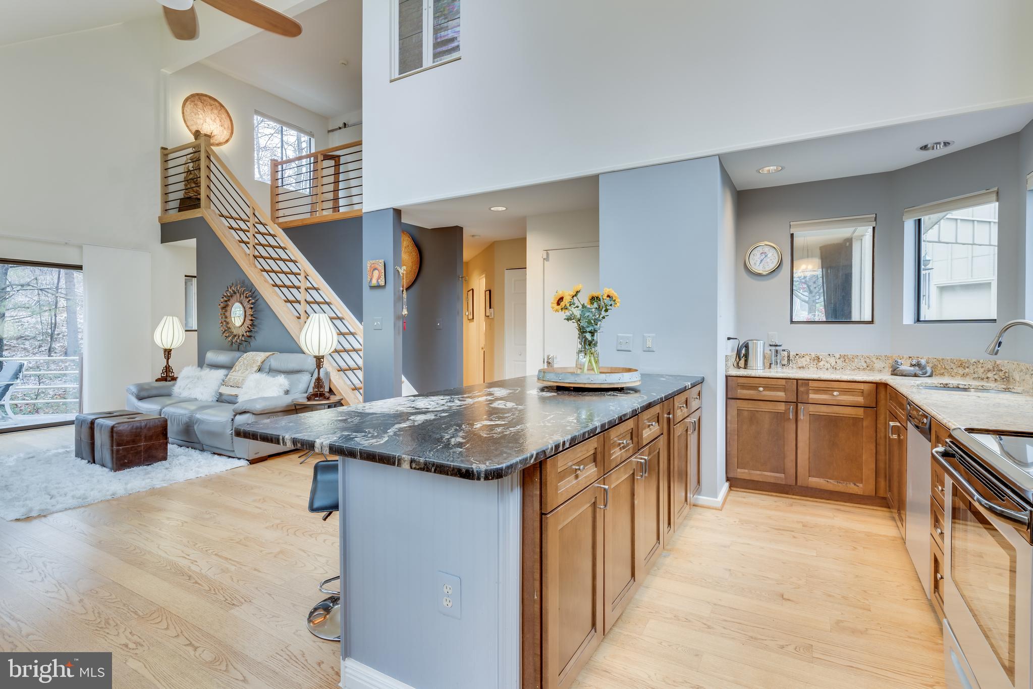 11900 Moss Point Lane Reston, VA 20194 - Photo 4 of 33 a kitchen with stainless steel appliances granite countertop a stove and a sink