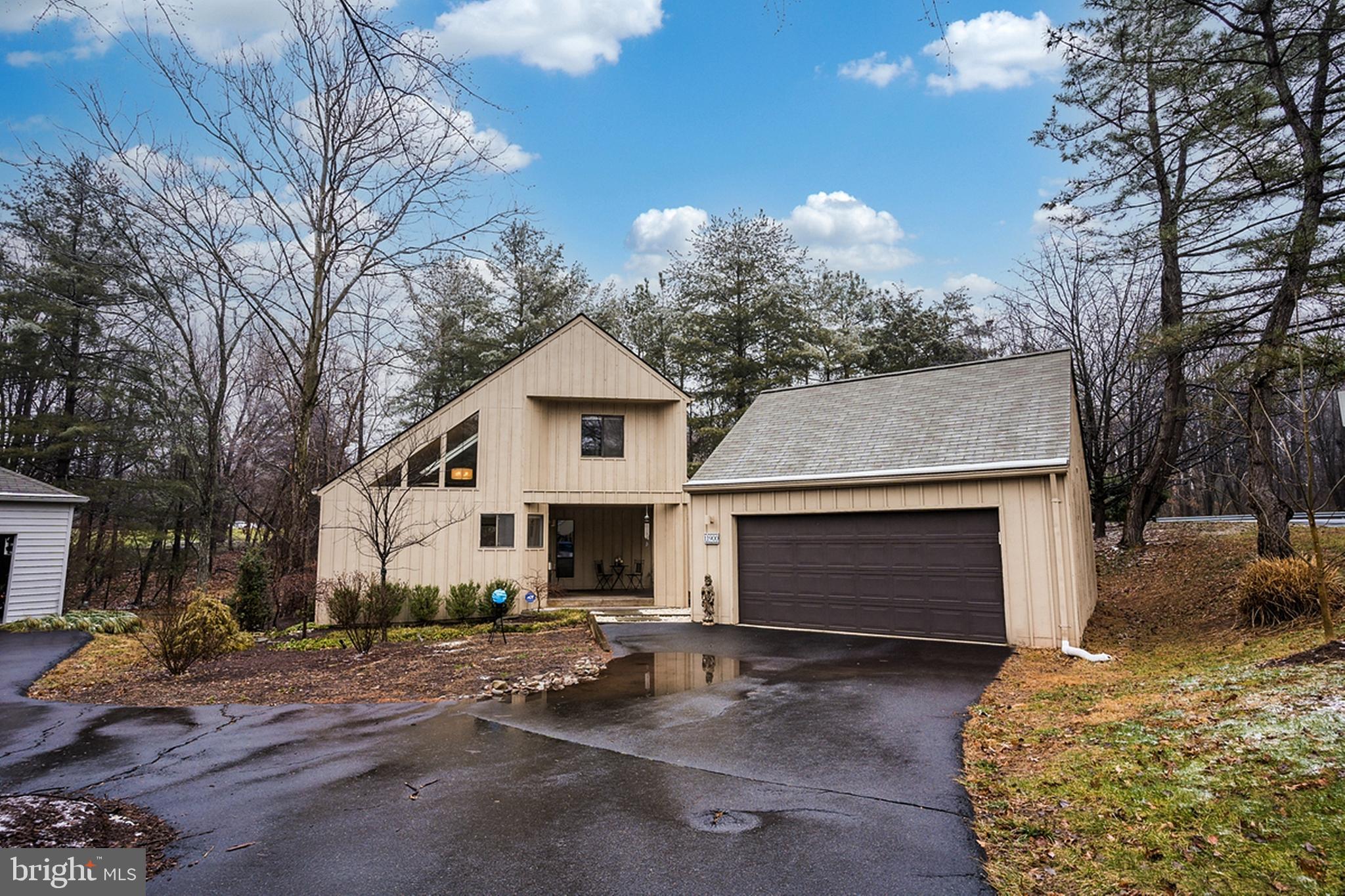 11900 Moss Point Lane Reston, VA 20194 - Photo 28 of 33 a front view of a house with garden