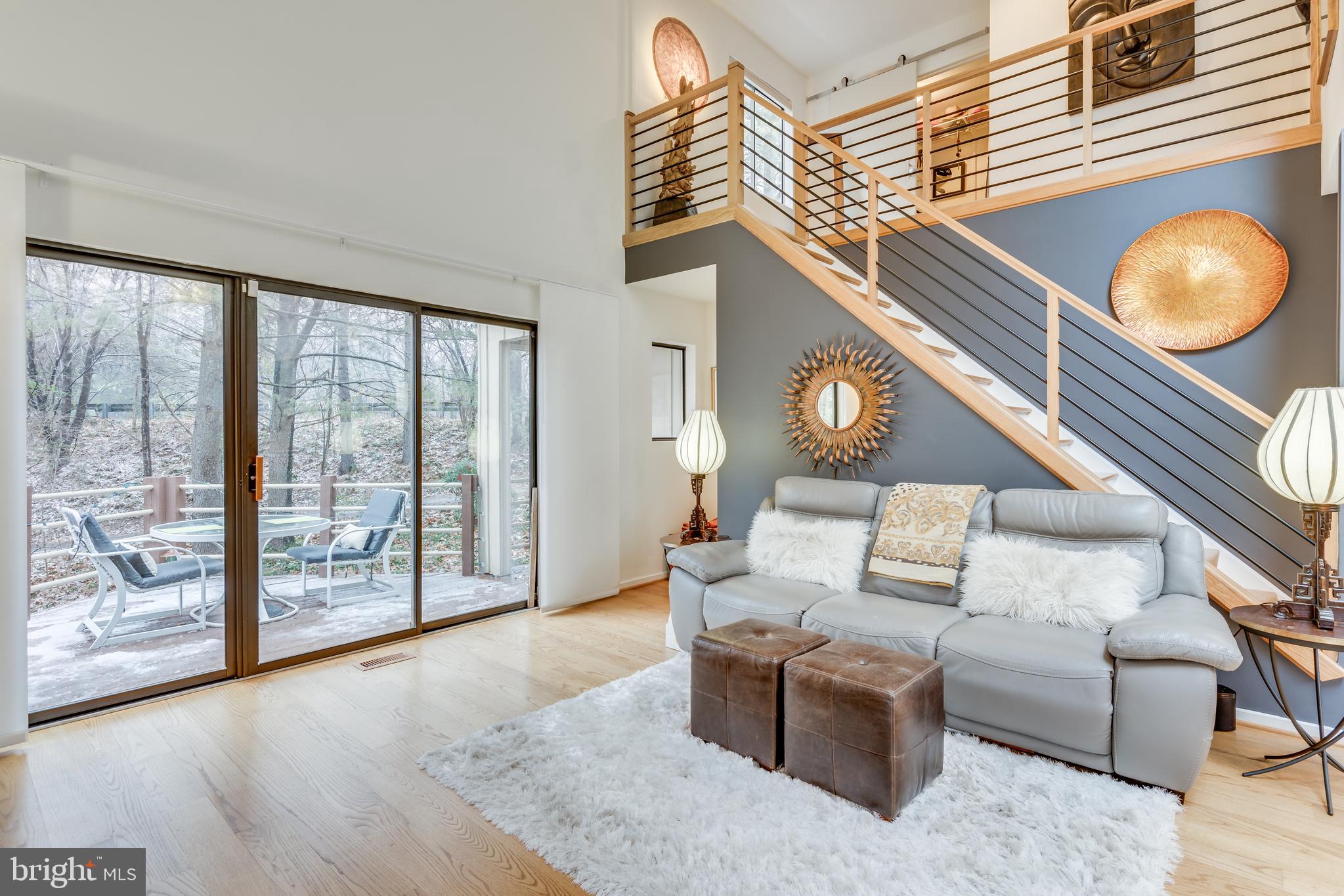 11900 Moss Point Lane Reston, VA 20194 - Photo 8 of 33 a living room with furniture and a large window
