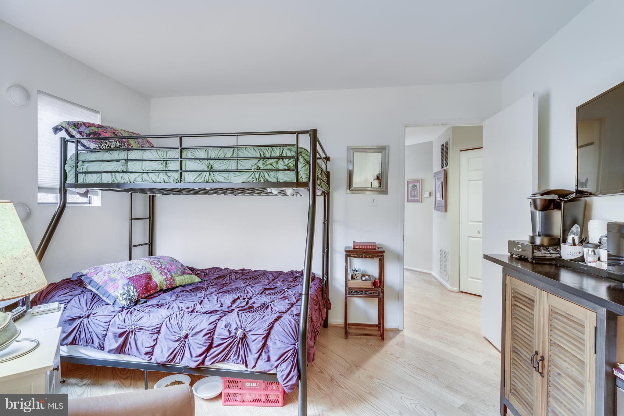 11900 Moss Point Lane Reston, VA 20194 - Photo 10 of 33 a bedroom with a bed a table and chair