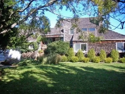 a view of house with yard