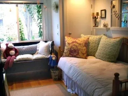 a bedroom with bed and window