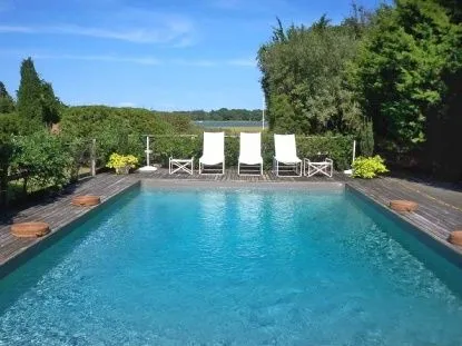 a view of a lake with a flower garden