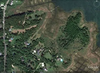 a view of a lake with a big yard