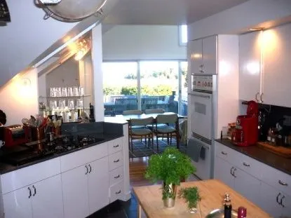 a kitchen with a table and chairs in it