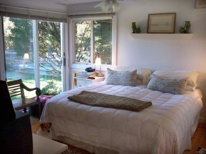1008 Springs Fireplace Road East Hampton, NY 11937 - Photo 7 of 19 a bedroom with a bed and wooden floor