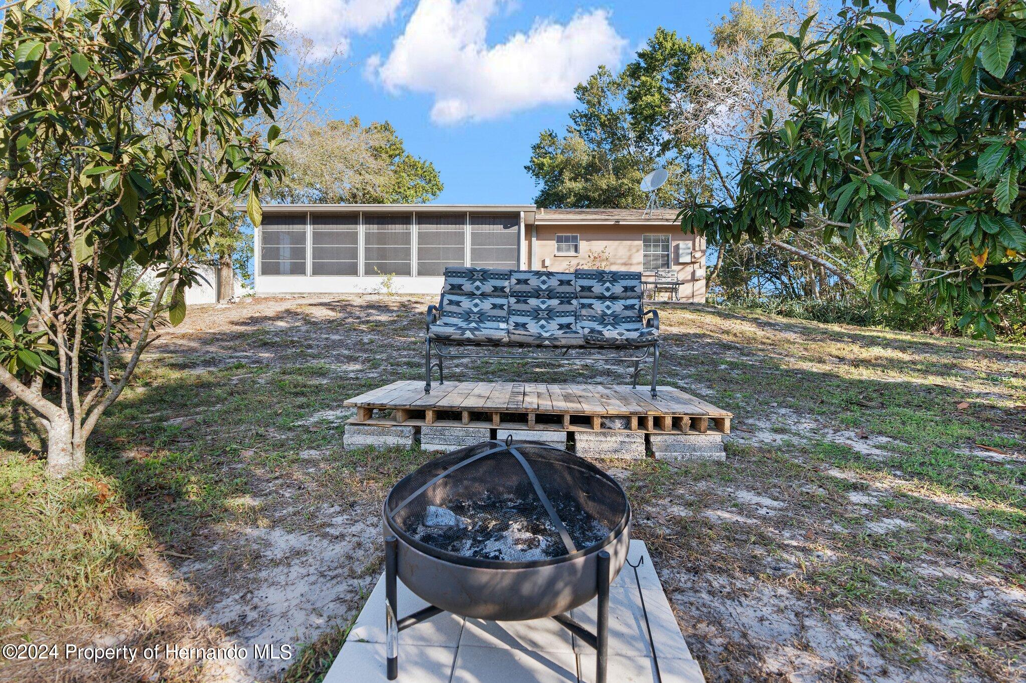 9124 Eldridge Road Spring Hill, FL 34608 - Photo 25 of 26 front view of a house with a yard
