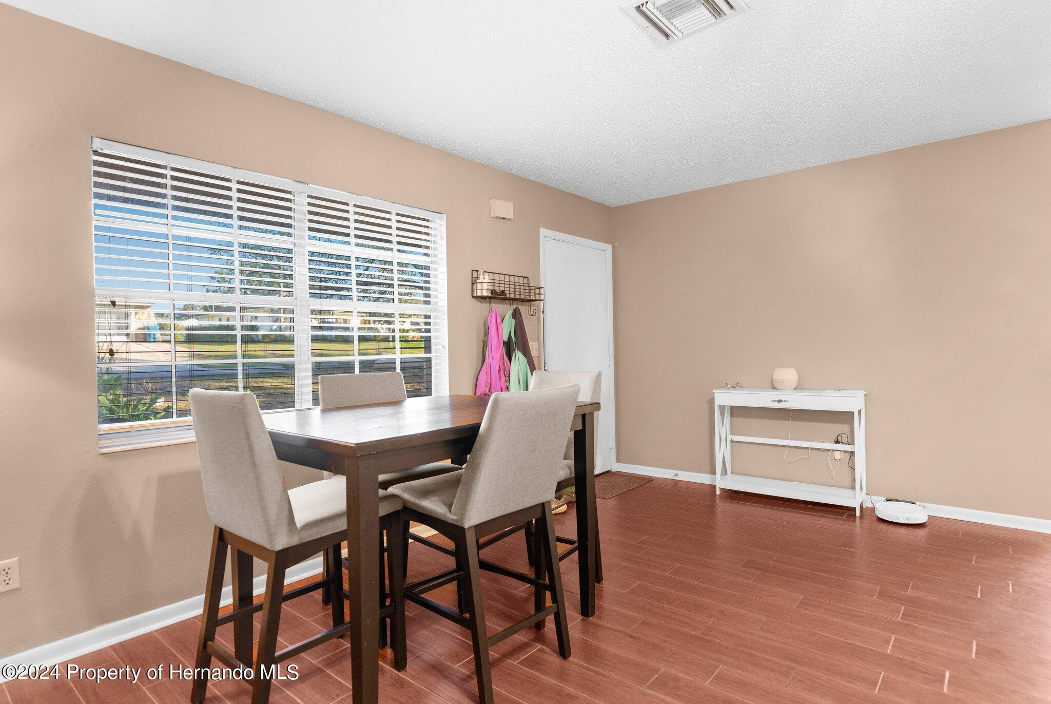 9124 Eldridge Road Spring Hill, FL 34608 - Photo 5 of 26 a view of a livingroom with furniture and a window