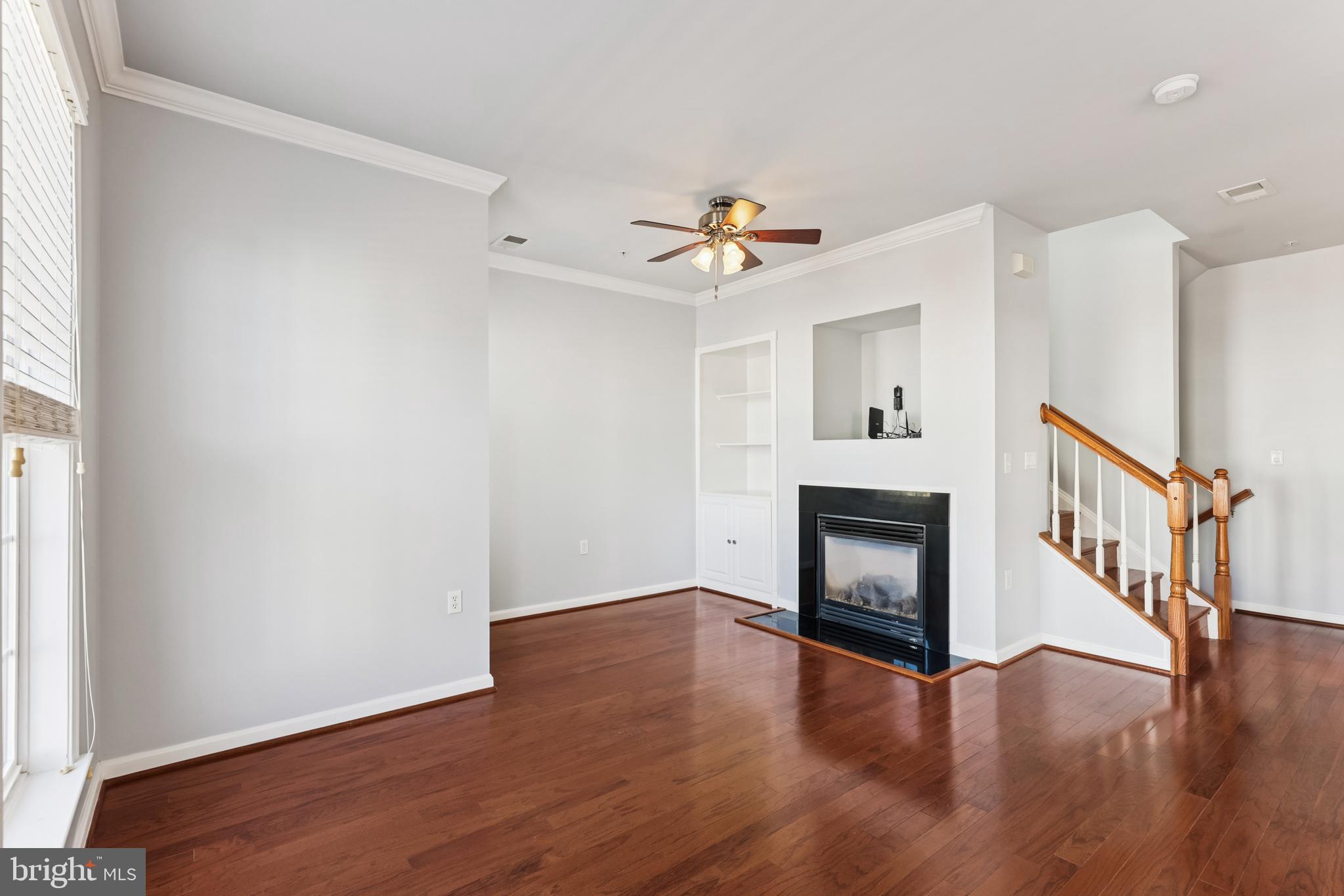 6821 Hampton Bay Lane Gainesville, VA 20155 - Photo 14 of 29 a view of an empty room with wooden floor and a window