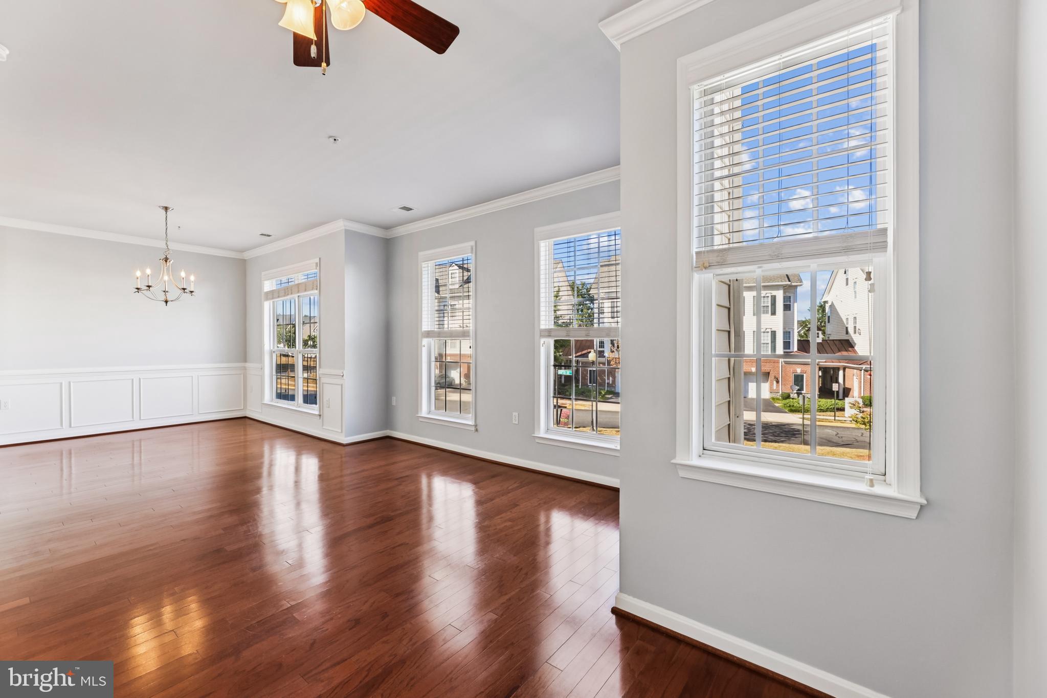 6821 Hampton Bay Lane Gainesville, VA 20155 - Photo 9 of 29 a view of an empty room with window and wooden floor