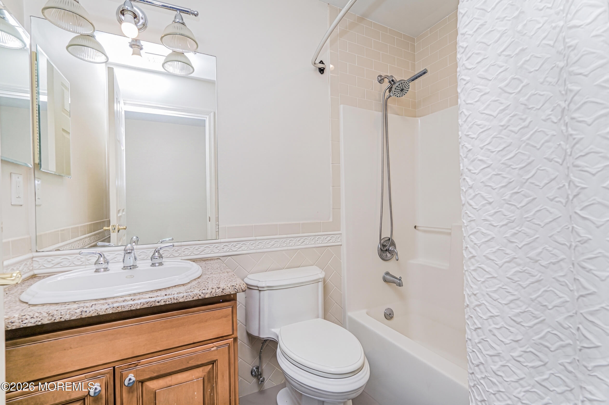 4 Wilson Boulevard Jackson, NJ 08527 - Photo 53 of 75 a bathroom with a granite countertop sink a toilet a mirror and shower