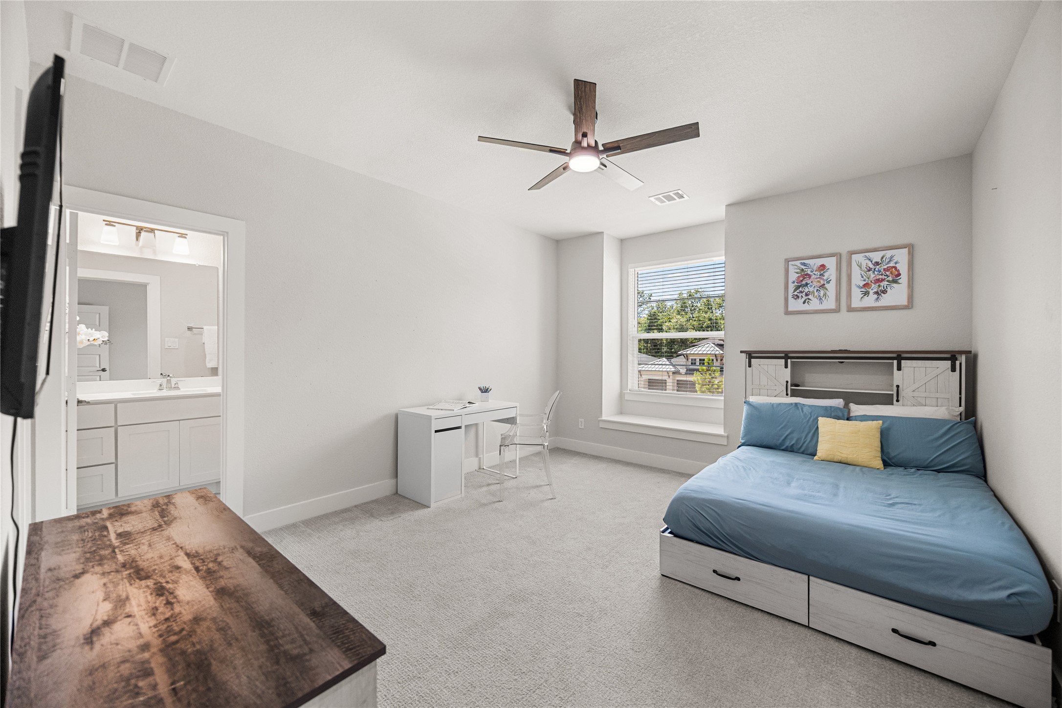 4130 Pleasant Ridge Drive Spring, TX 77386 - Photo 21 of 46 Another spacious secondary bedroom on the second floor, featuring abundant natural light, a large closet, and a private ensuite bathroom.