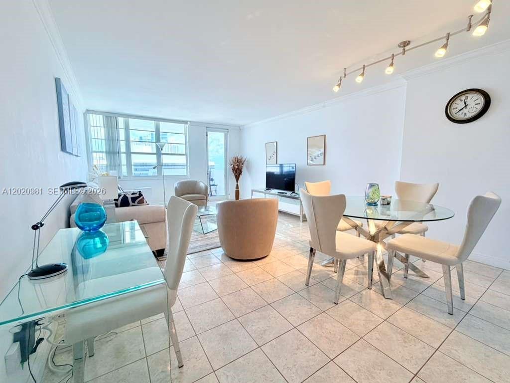 100 Lincoln Road, Unit 1423 Miami Beach, FL 33139 - Photo 1 of 17 a dining room with furniture and window
