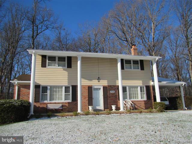 7014 Spaniel Road Springfield, VA 22153 - Photo 1 of 2 a front view of a house with garden
