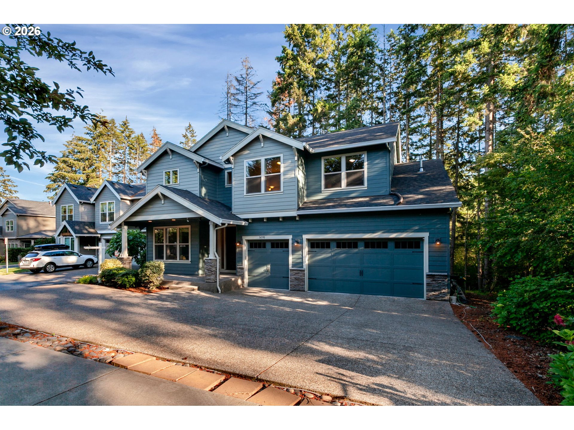 14390 Southwest Fox Lane Beaverton, OR 97008 - Photo 2 of 47 a front view of a house with a garden