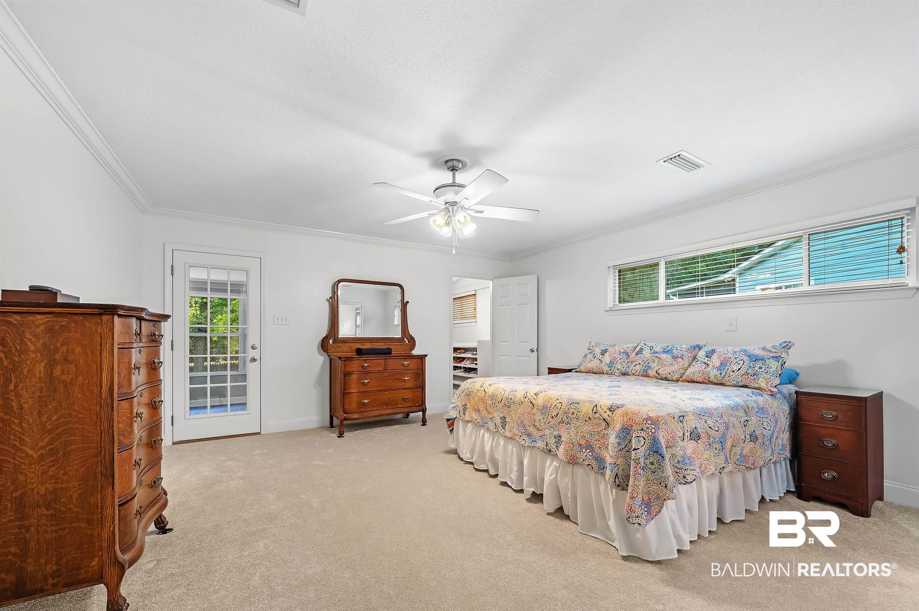104 James Circle Daphne, AL 36526 - Photo 46 of 62 Carpeted bedroom featuring ceiling fan, access to exterior, and crown molding