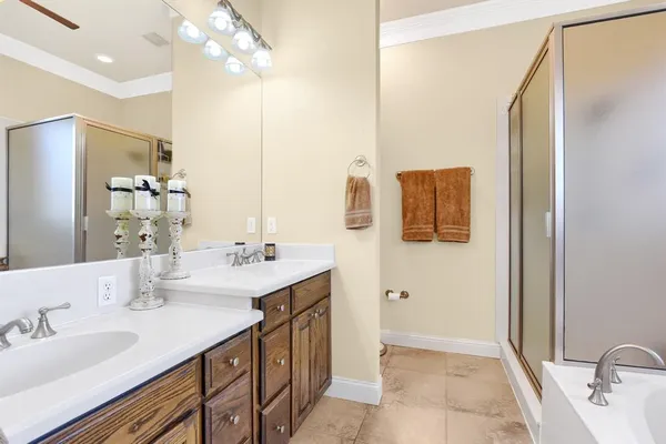 a bathroom with a double vanity sink mirror and
