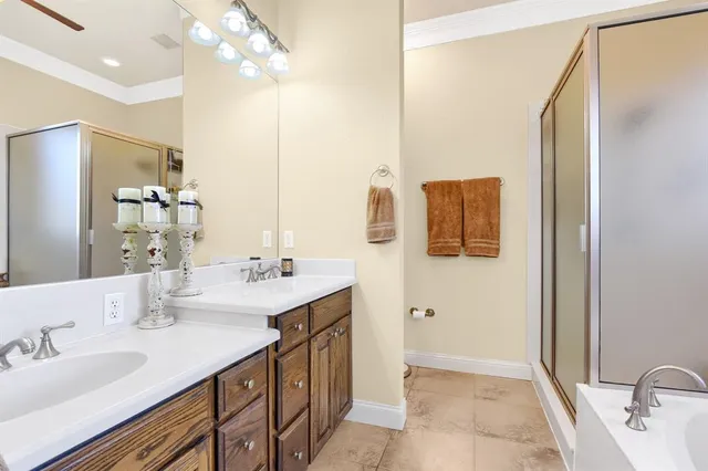 a bathroom with a double vanity sink mirror and