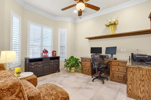 a bedroom with a workspace