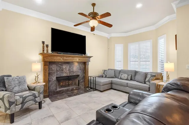 a living room with furniture fireplace and flat screen tv