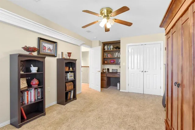 a view of a livingroom with a bookshelf