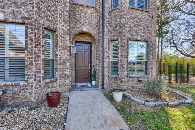 a front view of a house with outdoor seating