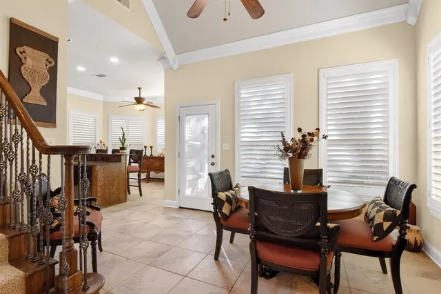 a living room with furniture a rug and a window