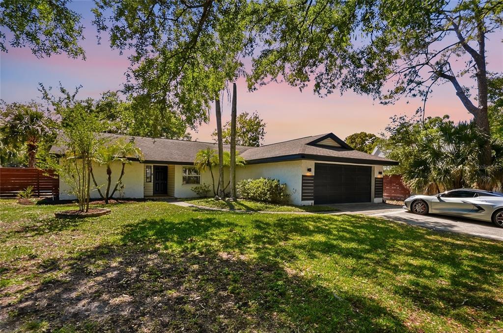 4606 Buckeye Road Tampa, FL 33624 - Photo 2 of 39 a house view with a garden space