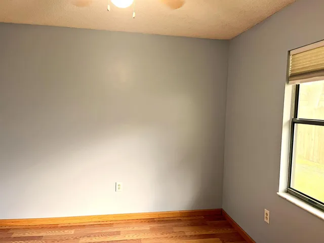 a view of an empty room and window