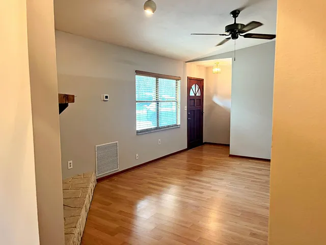 a view of an empty room with a window