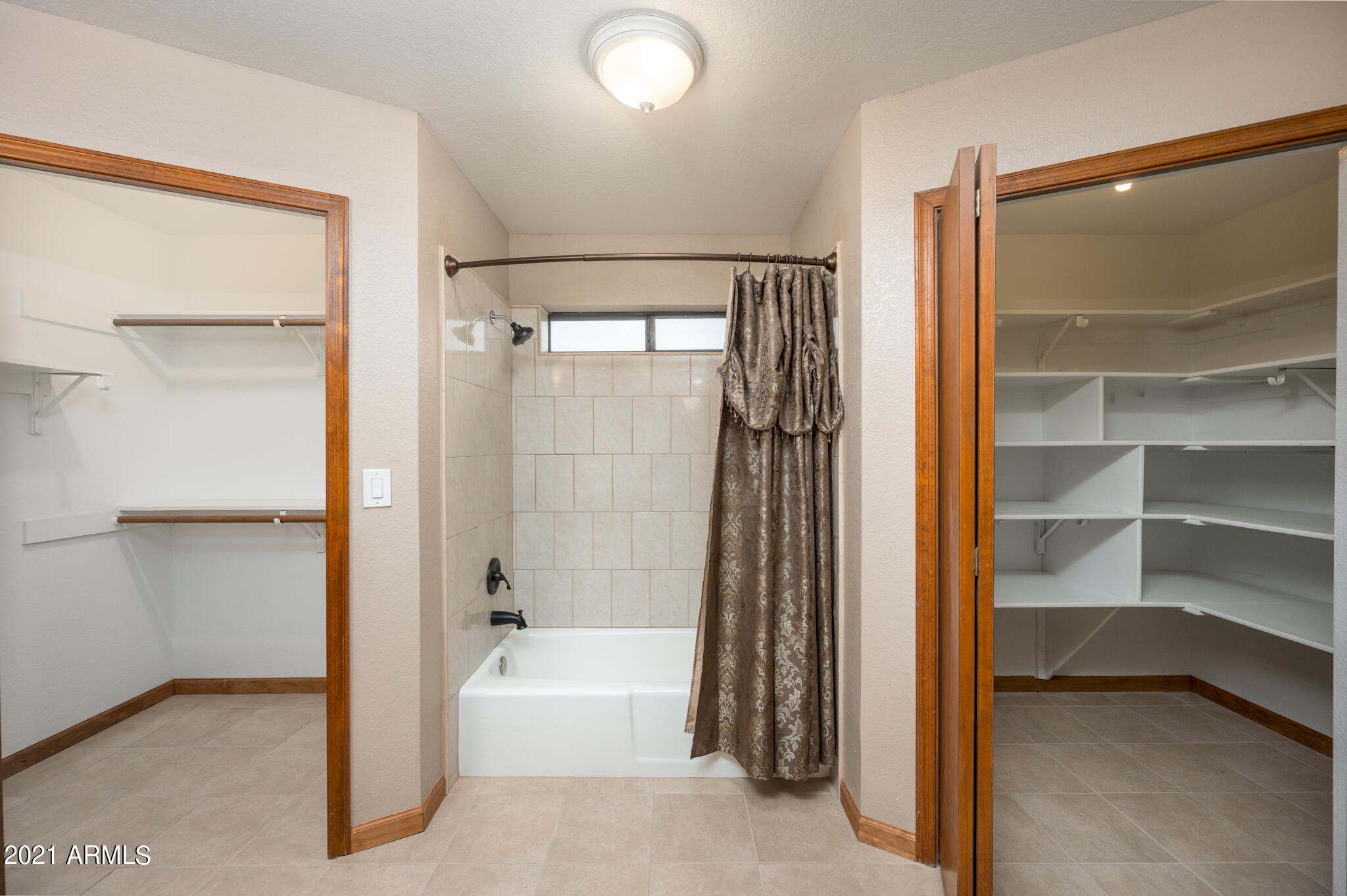 1735 North Rico Circle Mesa, AZ 85213 - Photo 27 of 48 His & Hers Walk-In Closet w/ Built-Ins