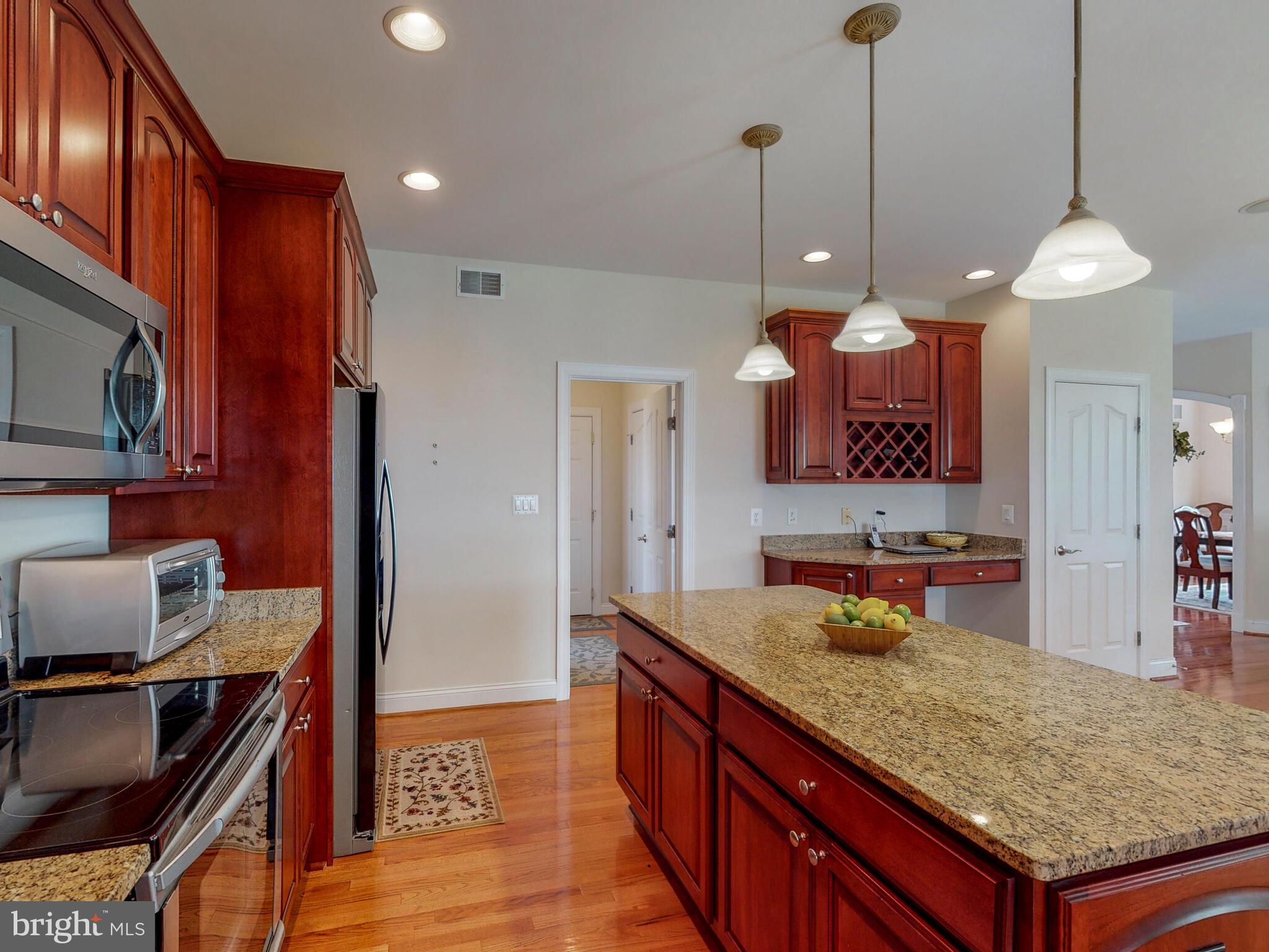 7808 Longridge Road Baltimore, MD 21236 - Photo 13 of 36 Tons of cabinets, storage, wine storage, desk