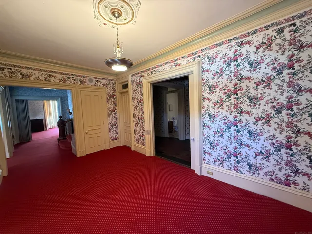 a close view of a chandelier in hallway