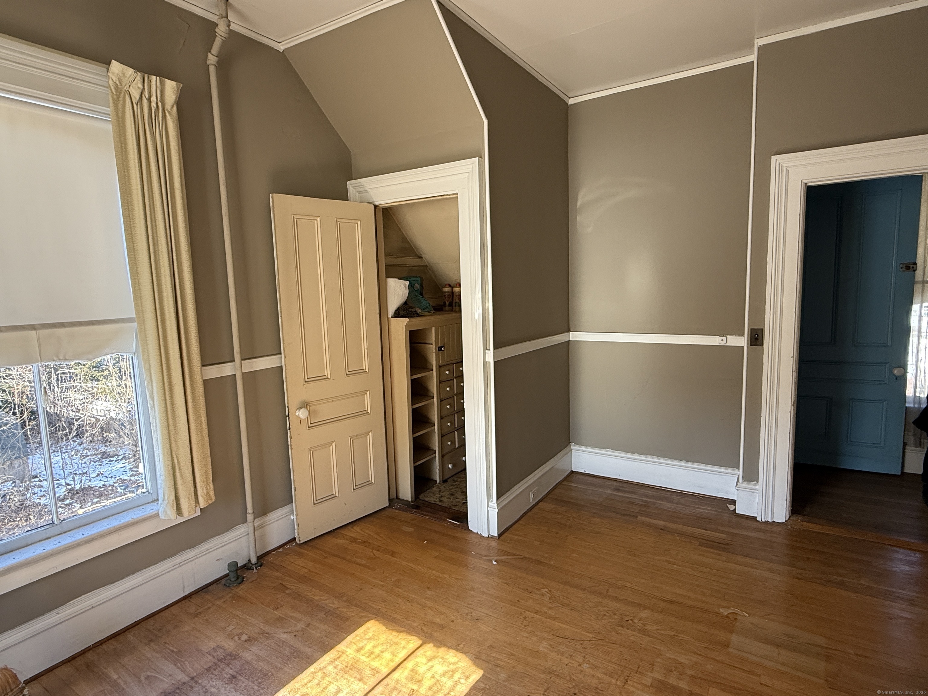 55 Walnut Street Winchester, CT 06098 - Photo 24 of 37 an empty room with wooden floor and a window